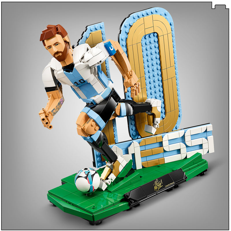 Toy figure of a soccer player in action with a large number '10' and the name 'Messi' on a gray background